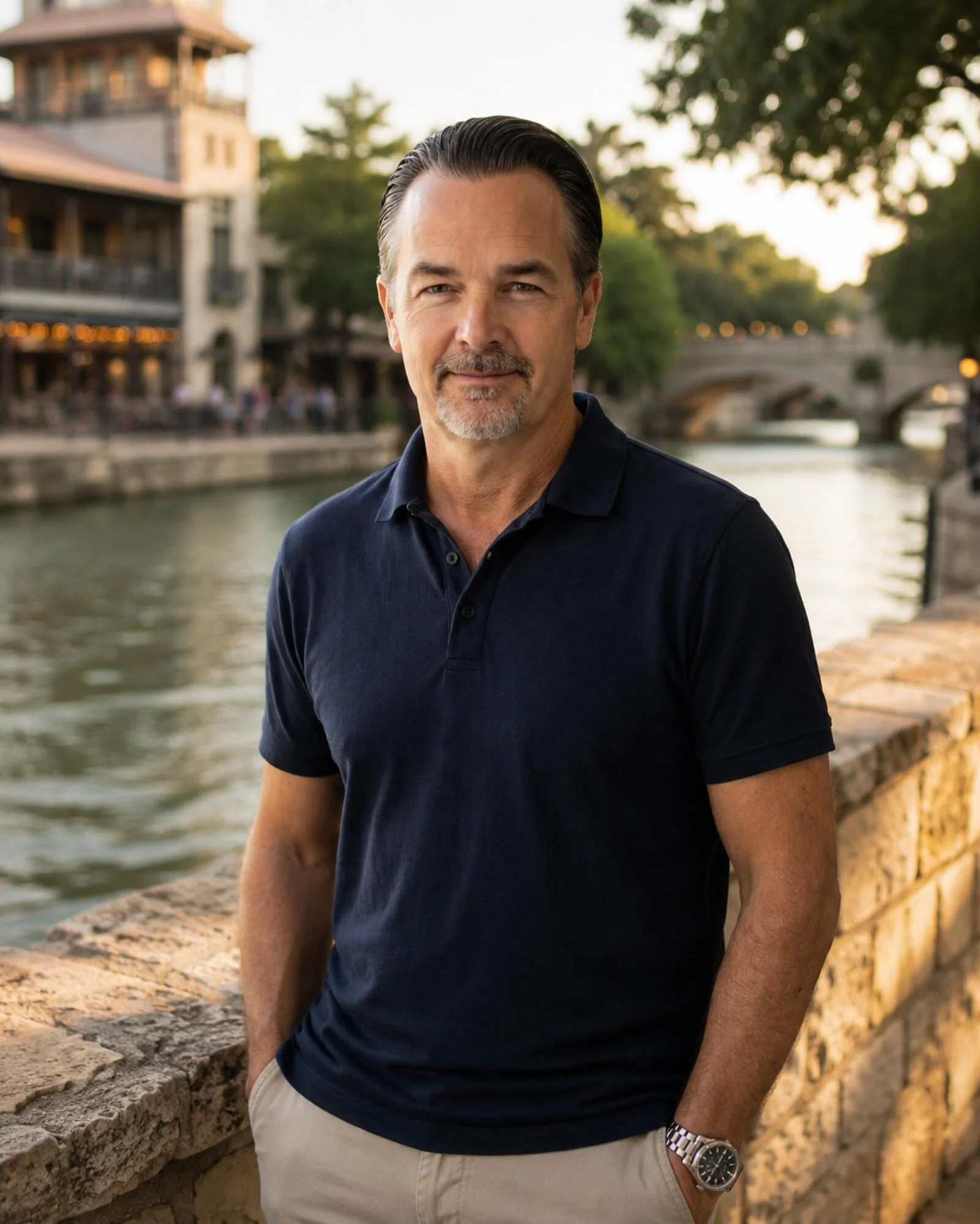 Editorial portrait of Todd Spencer along the Comal riverwalk in New Braunfels at golden hour.